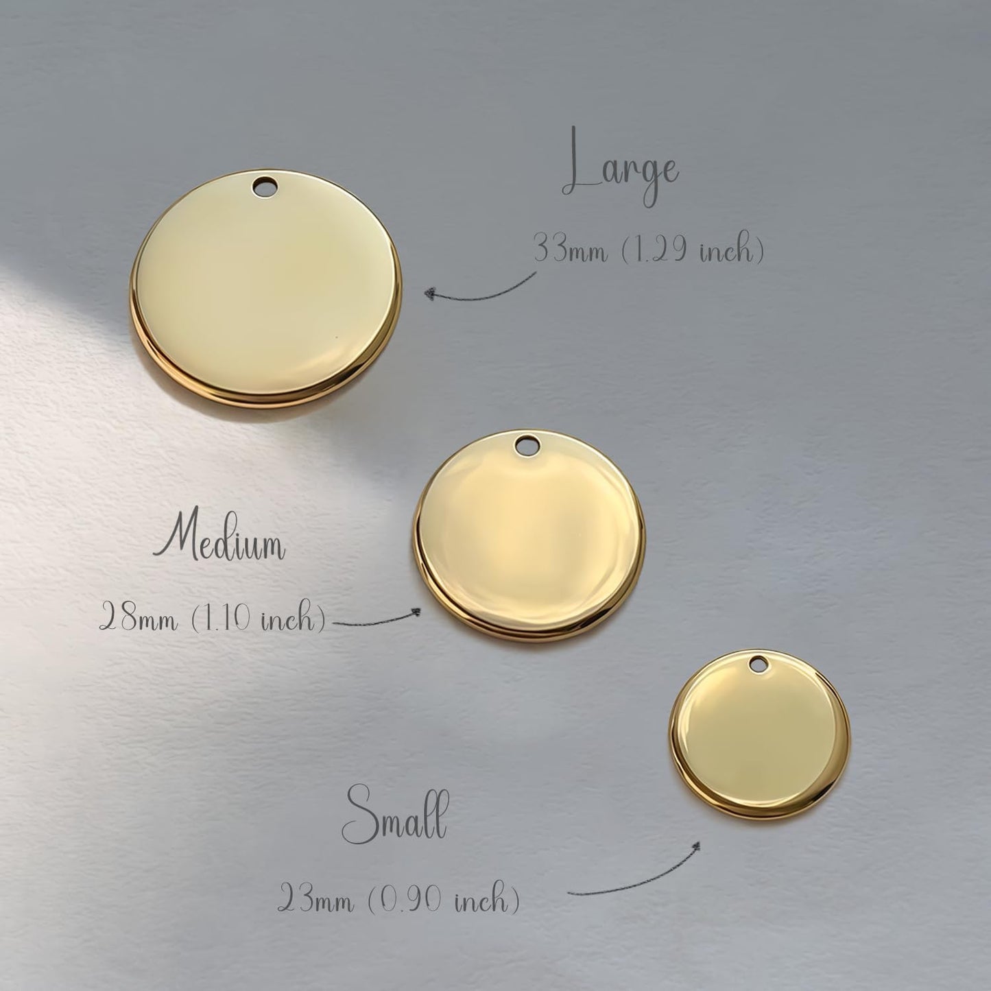 Polished custom pet ID tags in various sizes attached to durable metal rings.