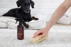 The Spruce Pet Stain And Odor Remover application on hardwood flooring.