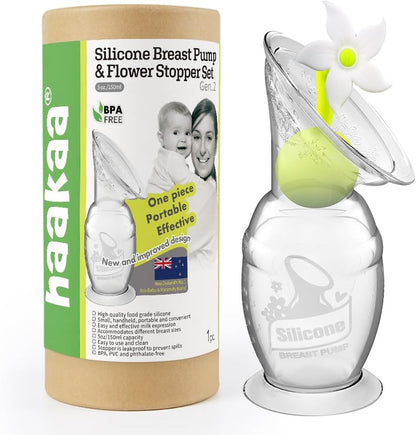 Haakaa manual breast pump front view with suction base and white flower stopper