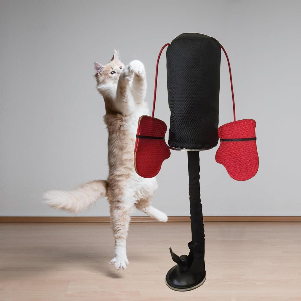 Spring loaded cat punching bag toy with suction cup base attachment