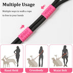 Adjustable two dog belt attached to pink training harnesses