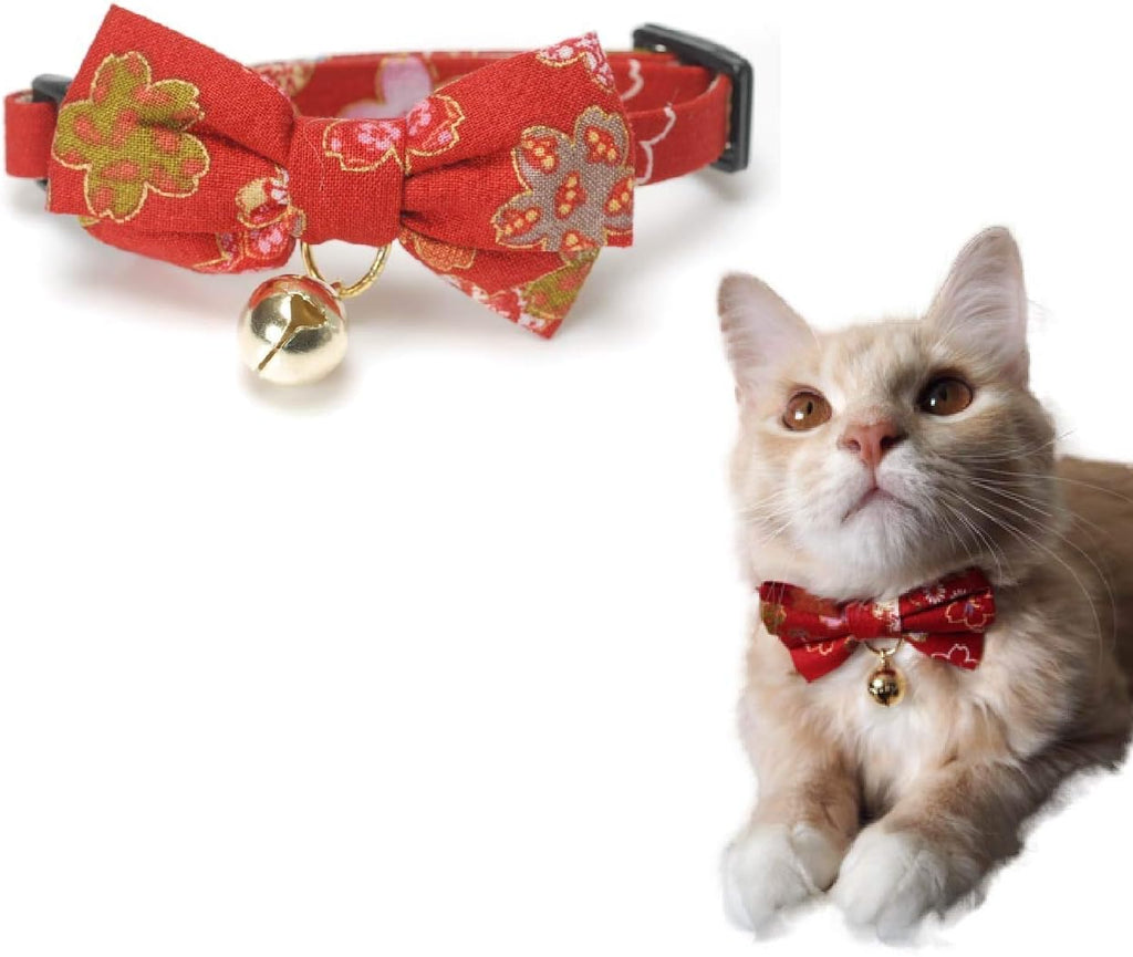 Flat lay presentation of the black Japanese print cat collar and accessories.