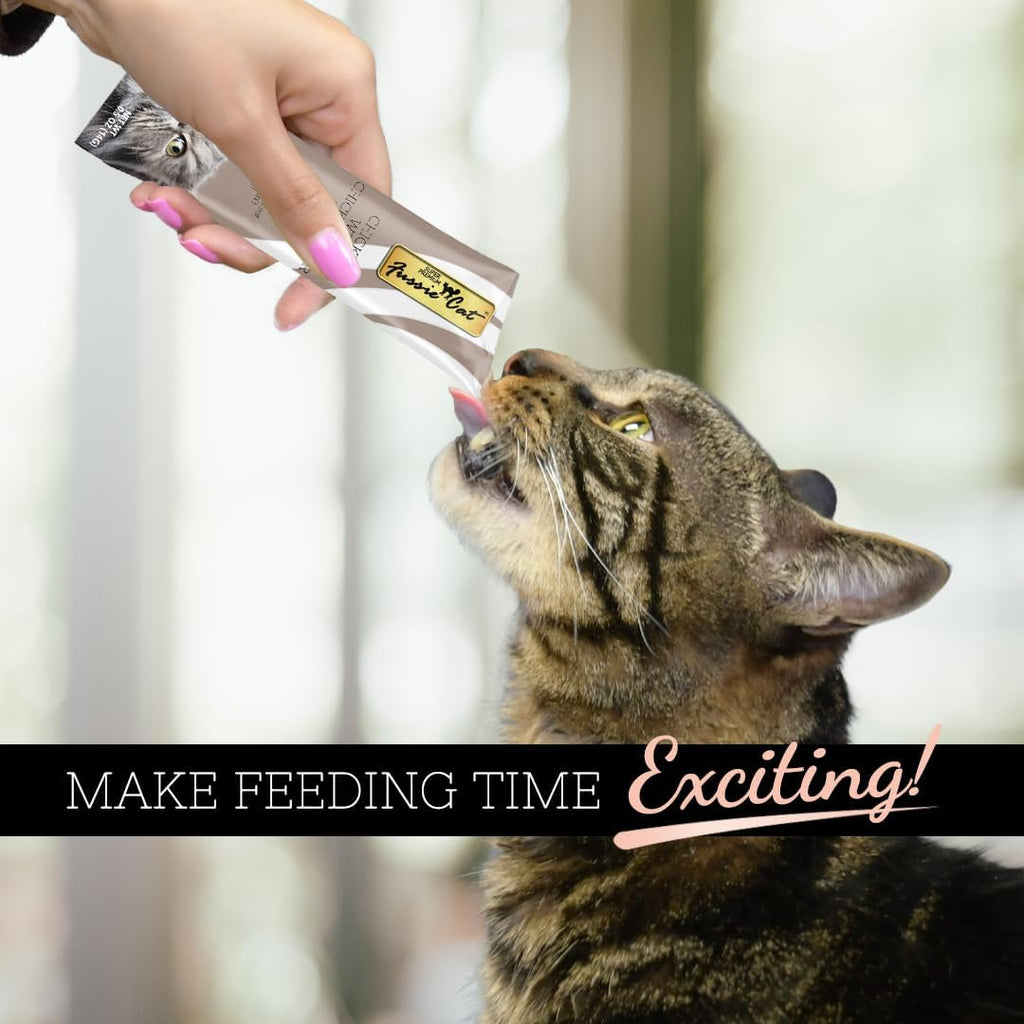 Cat enjoying Fussie Cat chicken and liver puree