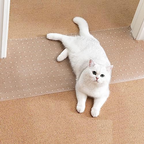 Uross cat scratch guard mat placed flat under a white wooden door