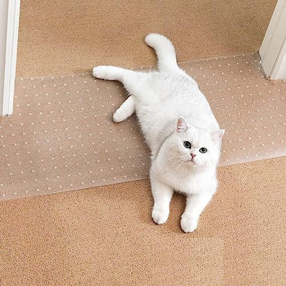 Uross cat scratch guard mat placed flat under a white wooden door