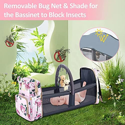 GurZinn pink diaper bag securely attached to a baby stroller handle using the included heavy duty stroller hooks