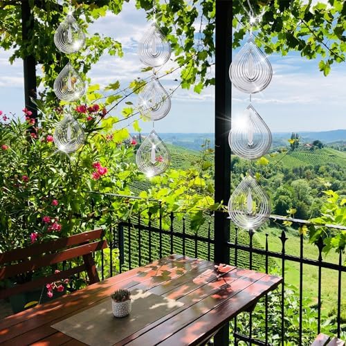Stainless steel reflective bird deterrent spinning in garden