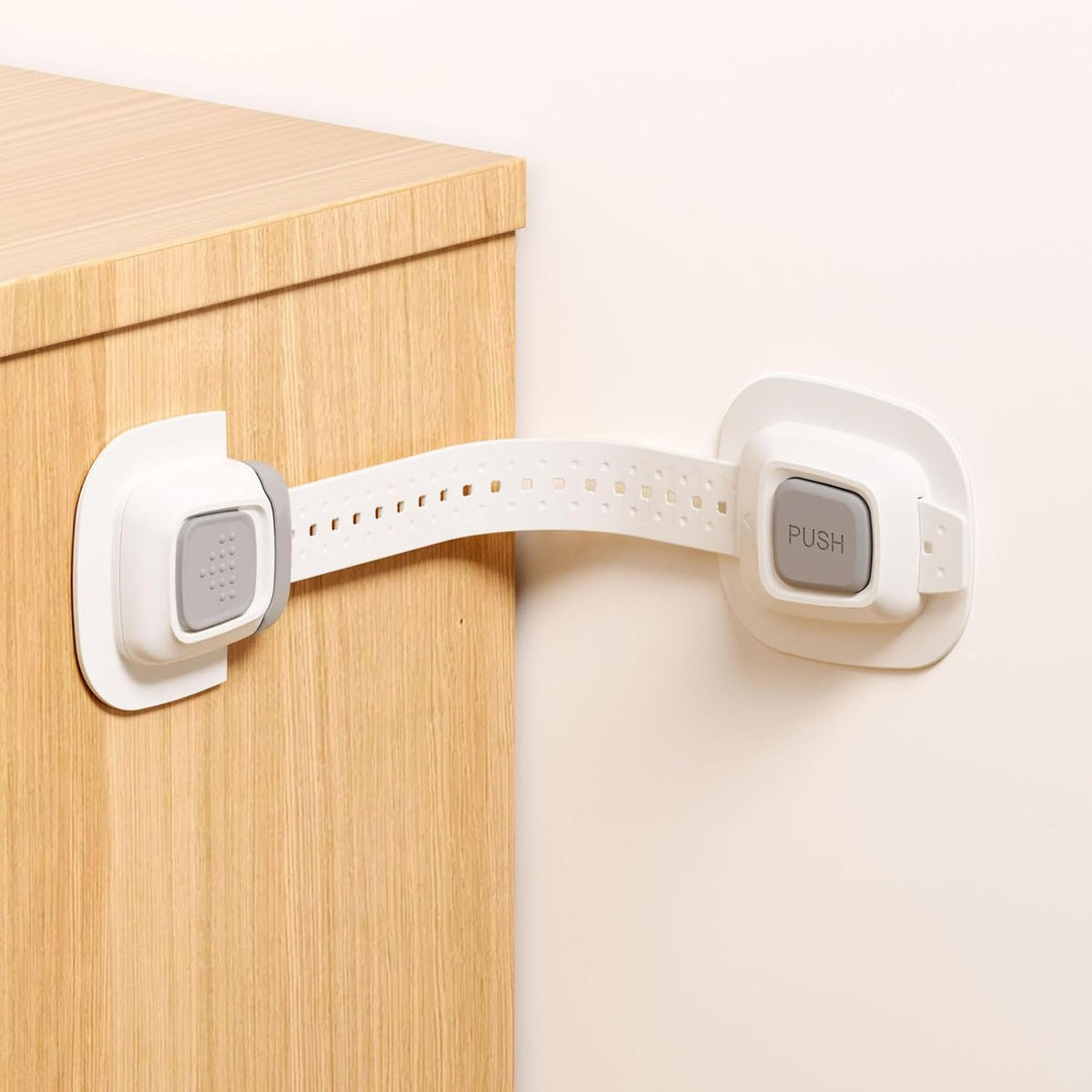 NestGuard no drill furniture anchor front view showing adhesive pads and adjustable strap for child safety.