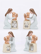 Heart shaped paw print cutout emitting soft golden light on statue base
