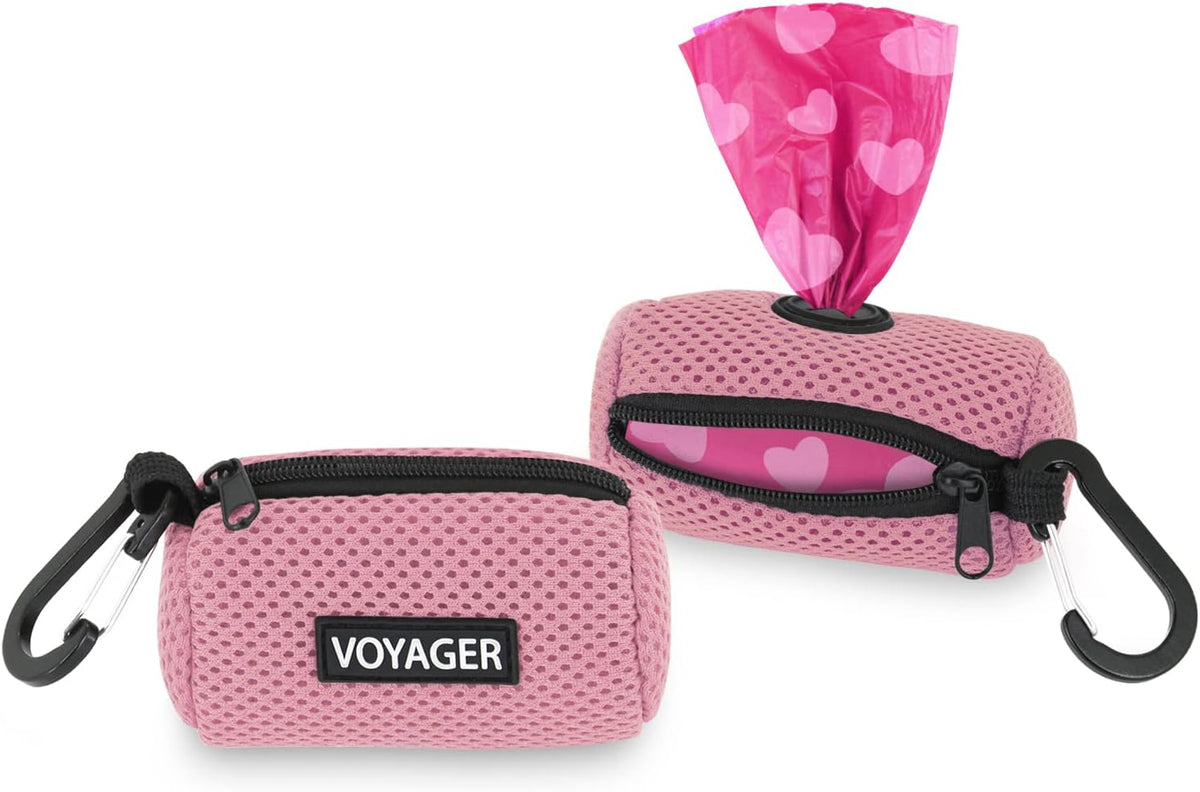 Heavy duty dog waste bag holder clipped to a pet harness for outdoor walks.