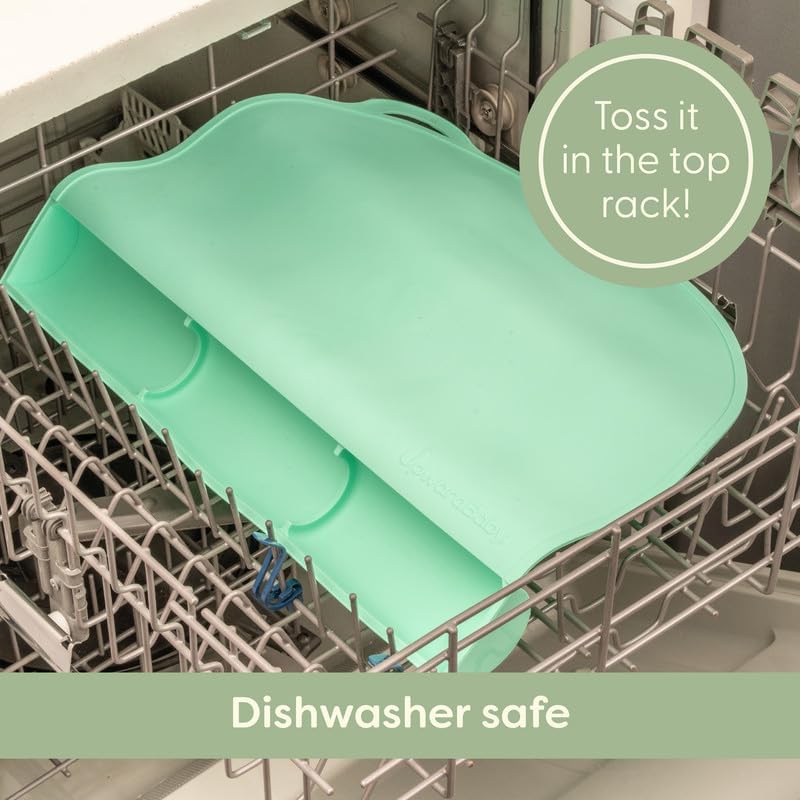Dishwasher safe silicone placemat being cleaned after a messy toddler mealtime.