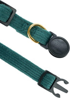 Soft orange corduroy cat collar with golden jingle bell close up view