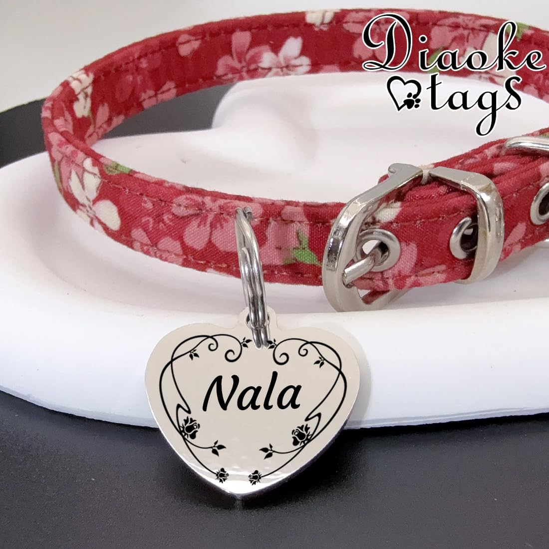 Handmade personalized pet collar charm with durable split ring attachment close up view.