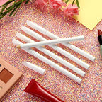 Demonstration of the integrated cap pusher trimming nail cuticles safely during a home manicure.