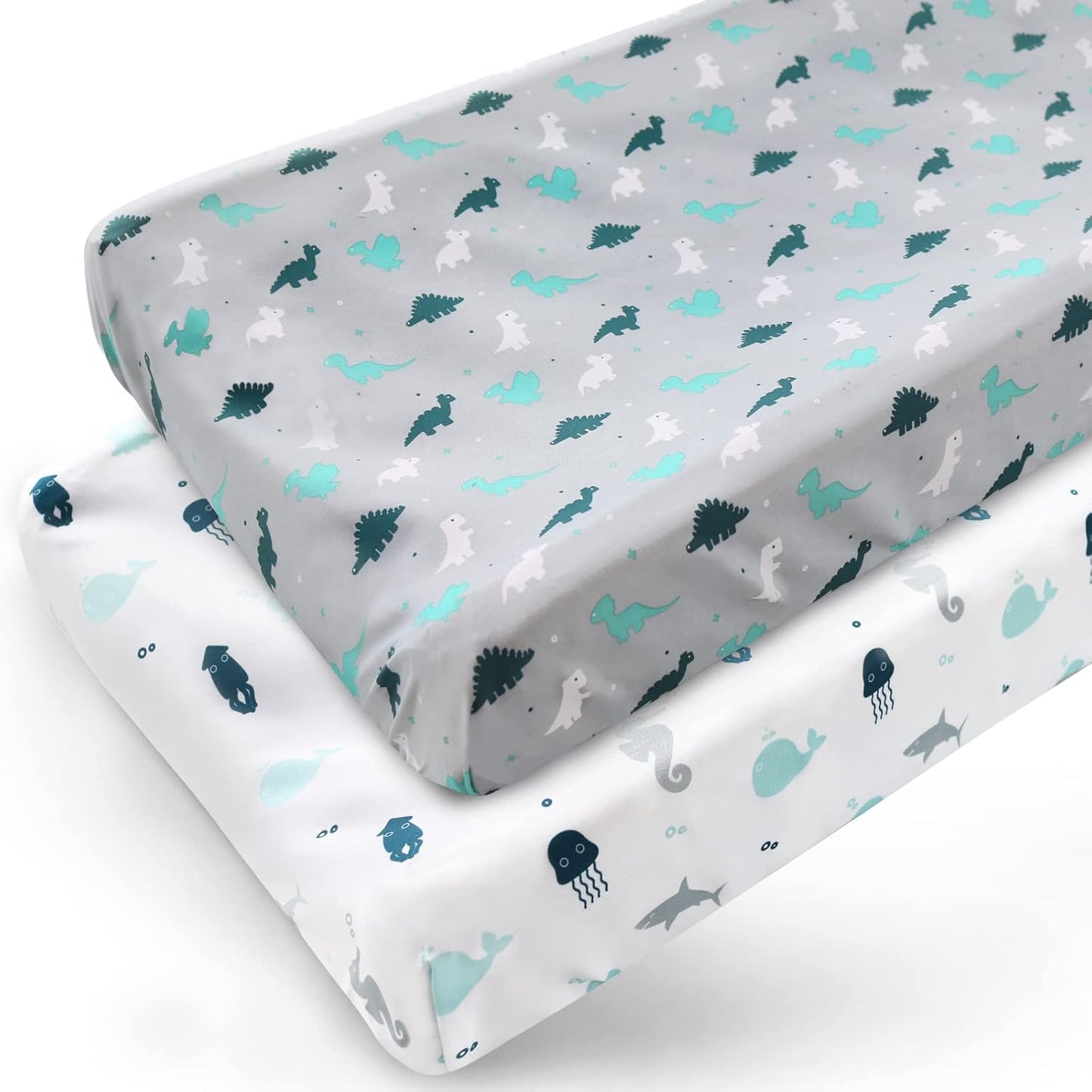 Springspirit diaper changing pad cover front view showcasing grey dinosaur and white ocean animal prints in a nursery setting.