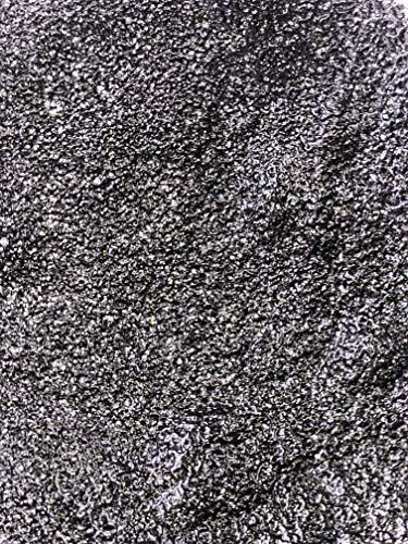 Sparkling light reflecting facets of quartz gravel underwater
