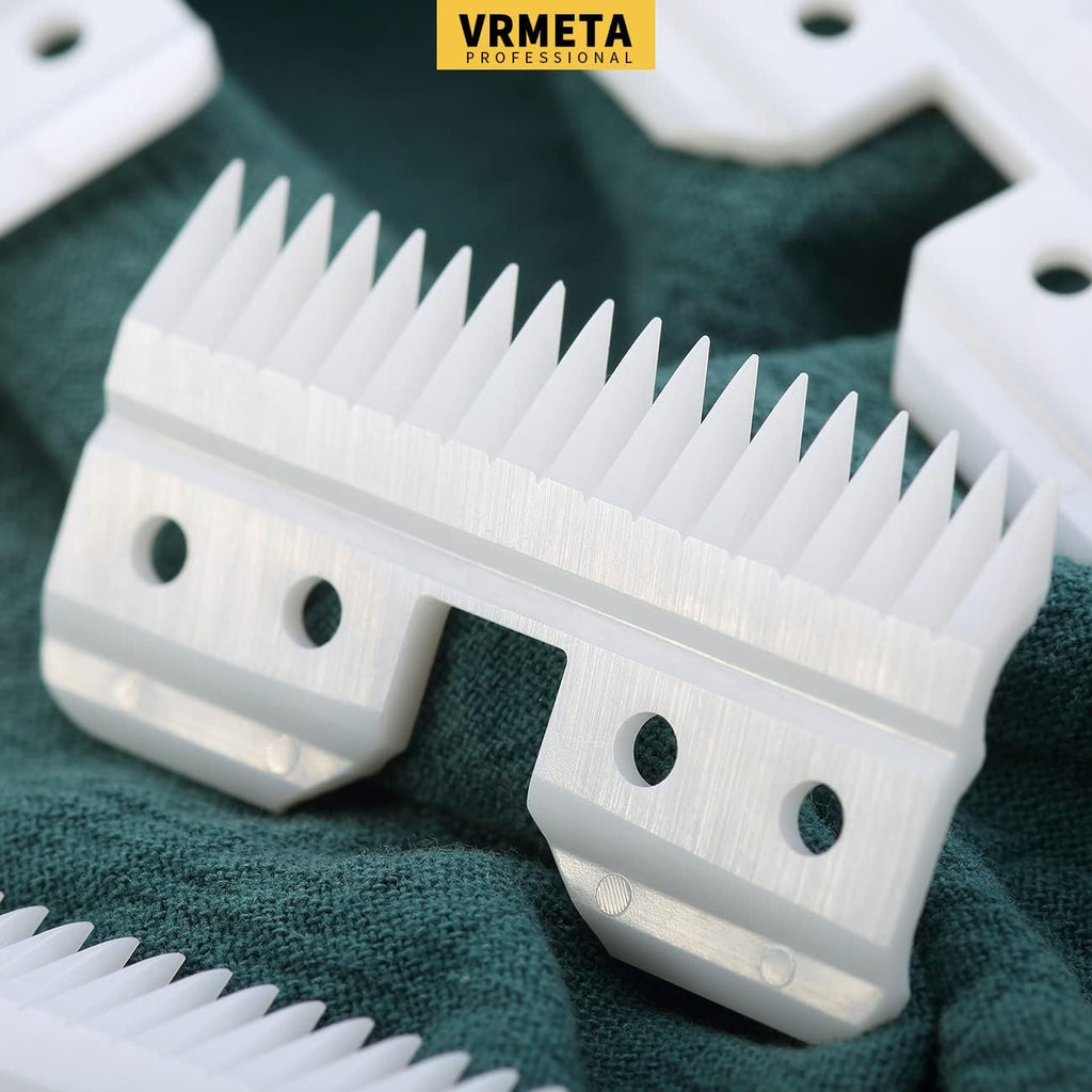 Four pieces of white ceramic clipper blades displayed on a clean background