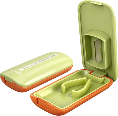 JohnBee Pill Cutter front view showing green compact housing and safety lid.