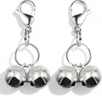 Lifestyle shot of the metallic pink pet pendant charm highlighting its high visibility color and gloss finish