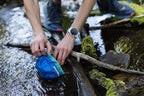 Ruffwear pocket friendly portable dog bowl next to running gear