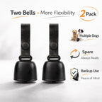 Authentic kcrygogo matte black cow bell showing the quick-release clip mechanism for dog collars