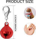 Close up of metal pet collar bell with lobster clasp