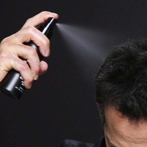 Authentic Toppik hair fiber locking mist container for securing thinning hair styles.
