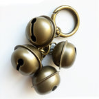 AYECEHI eight pieces pet bells for collar showing detailed brass construction