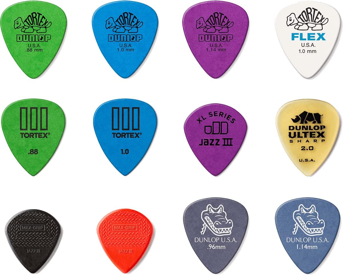 Twelve pack of premium Jim Dunlop imported electric guitar picks arranged to display different shapes and gauges.