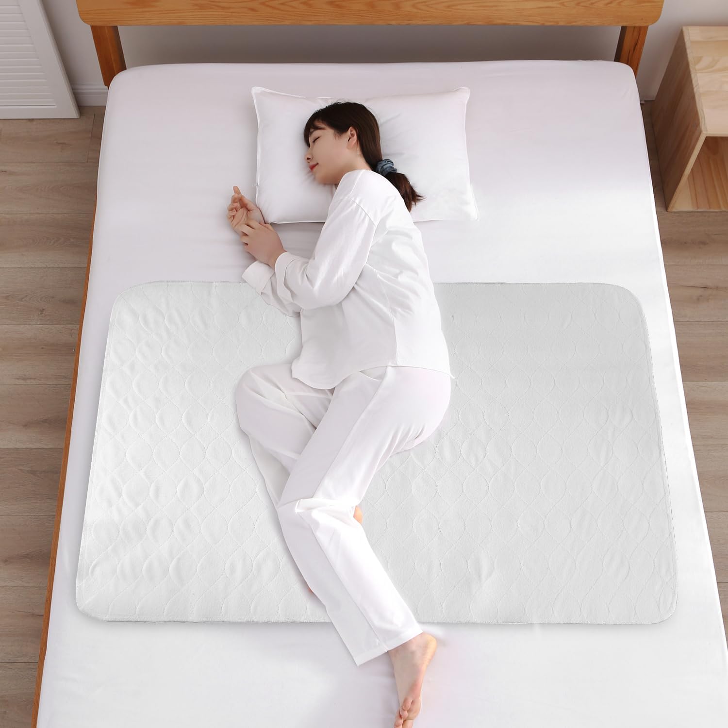Bamuho waterproof incontinence bed pad front view on a bed