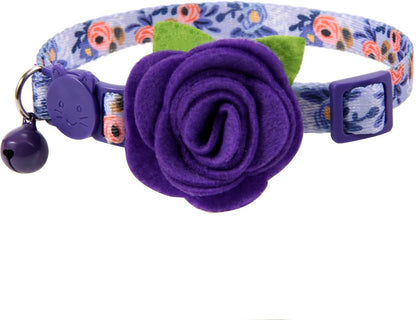 Detailed view of detachable flower charm on collar