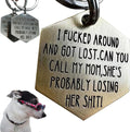 Generic funny dog tag front view showing engraved stainless steel pet ID text.