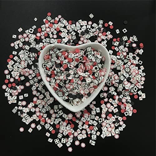 Miniature playing card and dice clay sprinkles scattered on flat surface