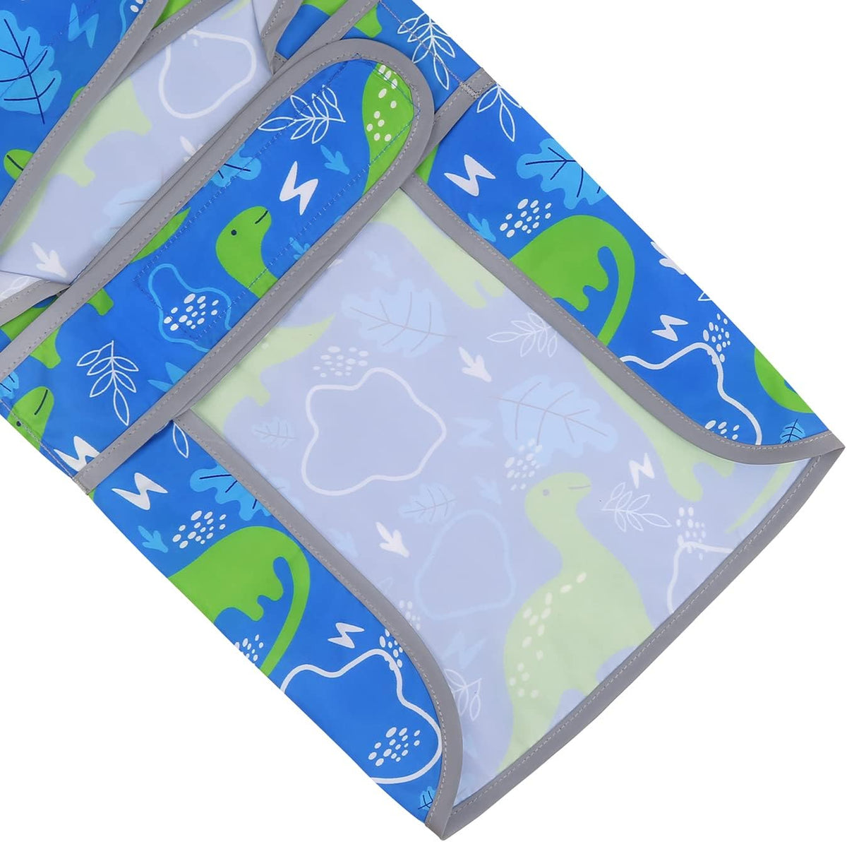 HDE dinosaur print pet raincoat folded flat to illustrate its compact travel design.