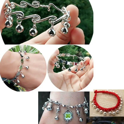 Three pack round silver tone jingle bells attached to durable split rings