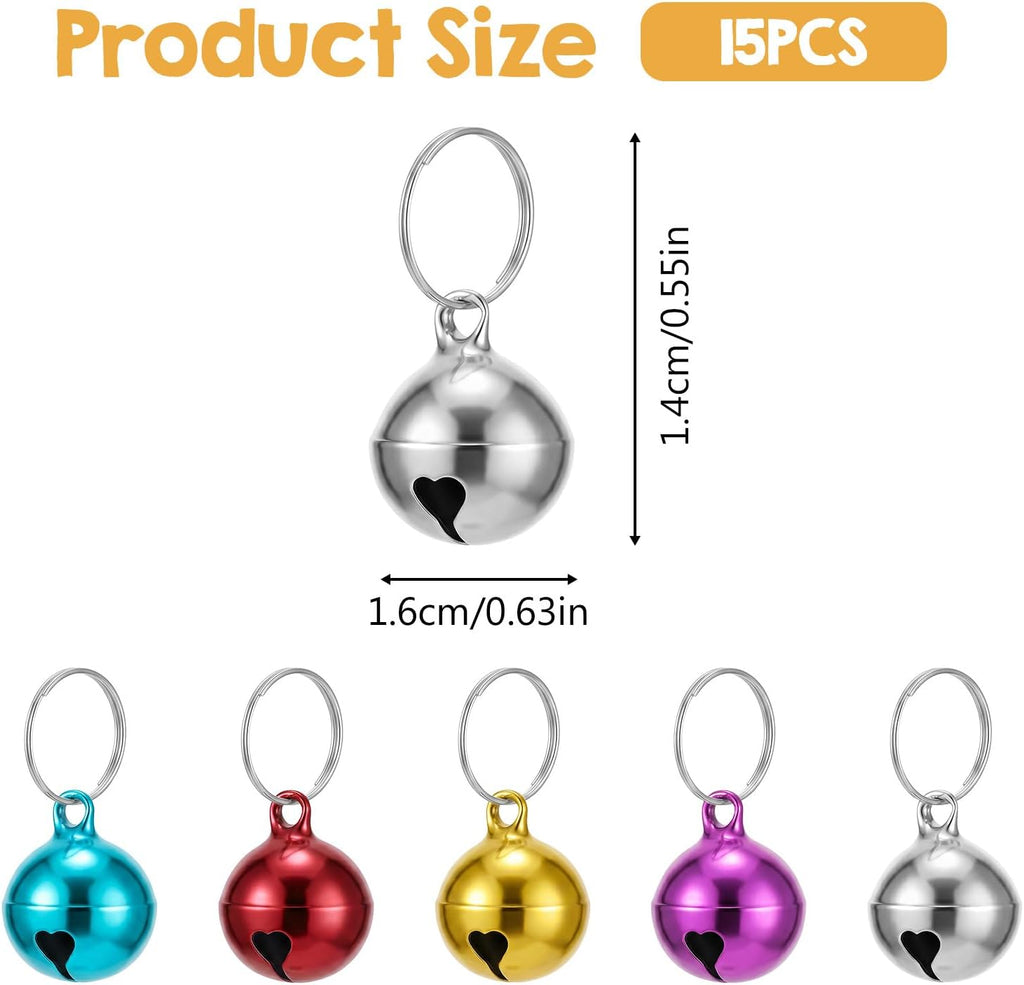 Close up of half inch mini dog collar jingle bells with heart shaped cutout details.