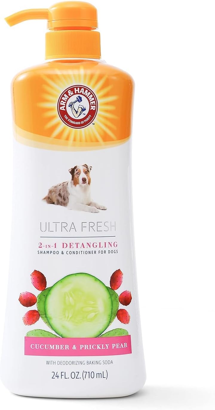 Applying Arm And Hammer bath spray on a dog coat