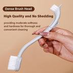 Close up view of MANON ROSA bird cage cleaning tool bristles removing stubborn residue