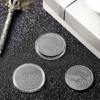 Hicarer silver lucky charm coin displayed on a desk surface