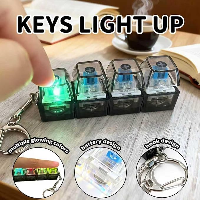 Pack of four mechanical switch fidget keyrings in different colors arranged neatly on a modern study desk setup