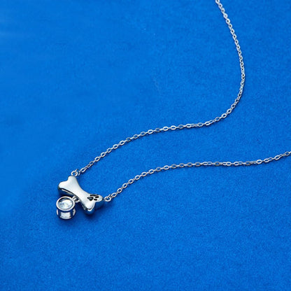 Personalized paw print projection jewelry showing photo preview mechanism.