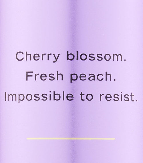 Victoria's Secret Love Spell refreshing body mist 250 ml packaging showing liquid detail.