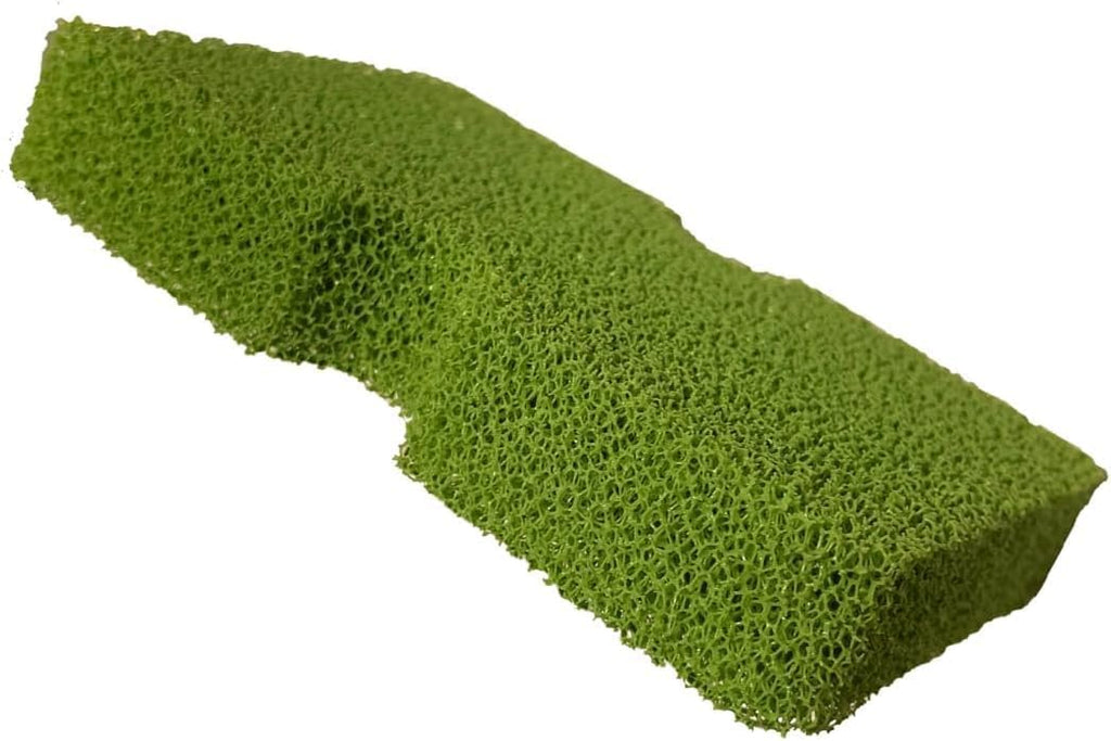 Textured green equestrian sponge for removing dirt from saddles and braided reins