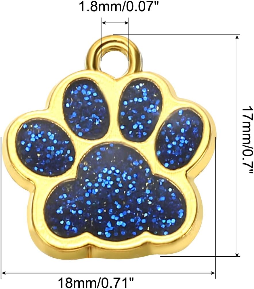 Ten pieces of light blue crystal footprint charms spread out on a white surface