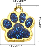 Ten pieces of light blue crystal footprint charms spread out on a white surface