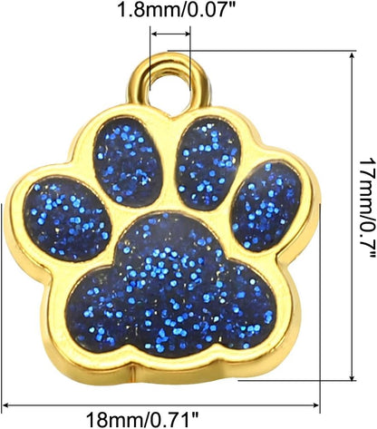 Ten pieces of light blue crystal footprint charms spread out on a white surface