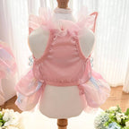 Cute small dog wearing rainbow butterfly wedding skirt