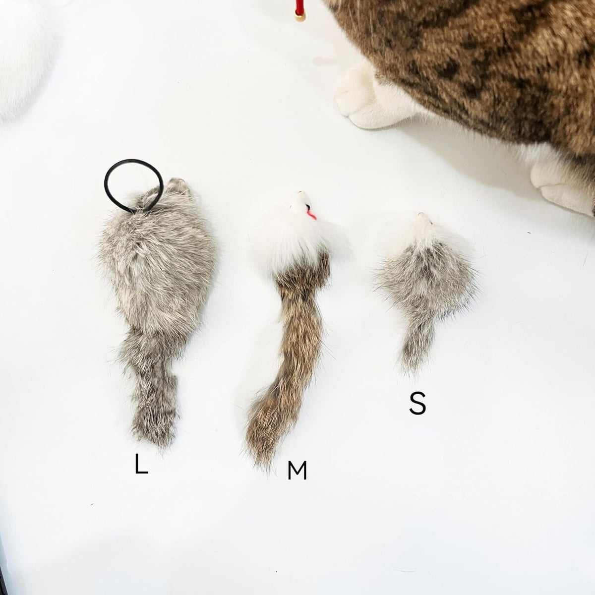 Caticalife genuine fur mouse toy attached to a hanging rope for self play