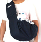 Small dog resting inside OrgMemory pet sling carrier