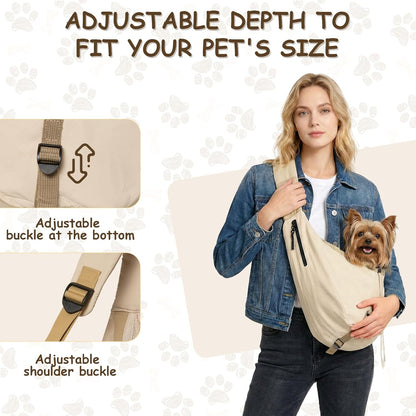 Small dog sitting inside beige pet sling carrier